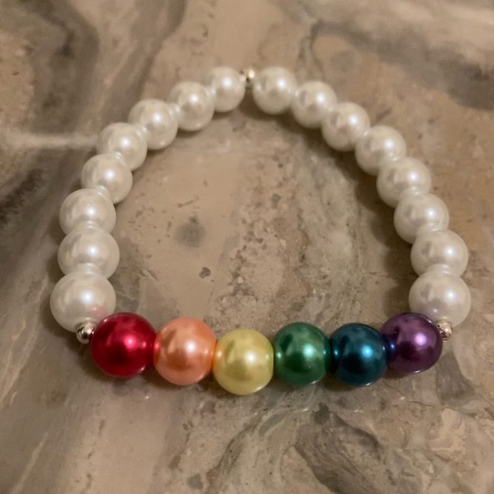 Rainbow glass PRIDE white bracelet: 6 1/4”-6 1/2”wrist. Double glued/hid knot.